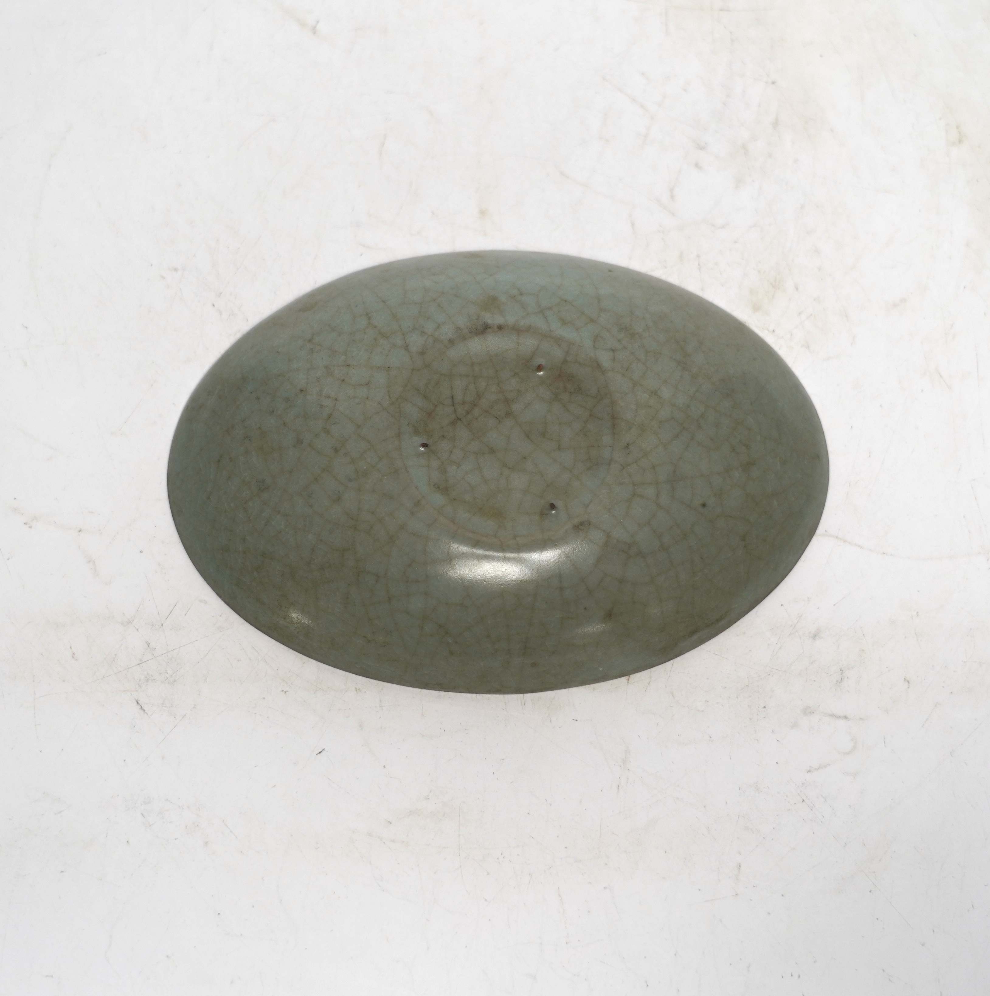 A Chinese oval celadon crackle glaze dish, 15.5cm wide